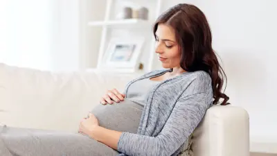 Pregnant women sitting on the couch